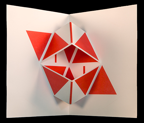 Three-dimensional folding poem features red geometric shapes spelling the words "Viva" and "Vaia" (hurrah and hissing).