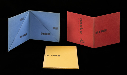 This trio of folded works printed on heavy red, yellow, and blue paper evokes the shape of boat sails. Each features four lines of verse: rosy far black / patched broken faded / lucky full / green fainter loath.